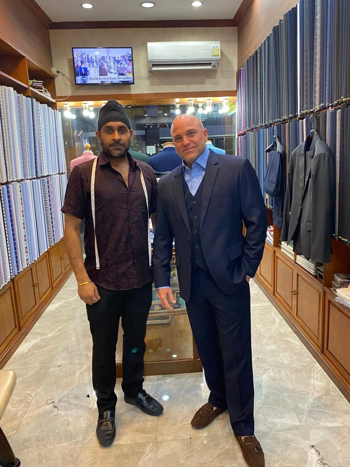 A.Moda tailor and customer in the shop